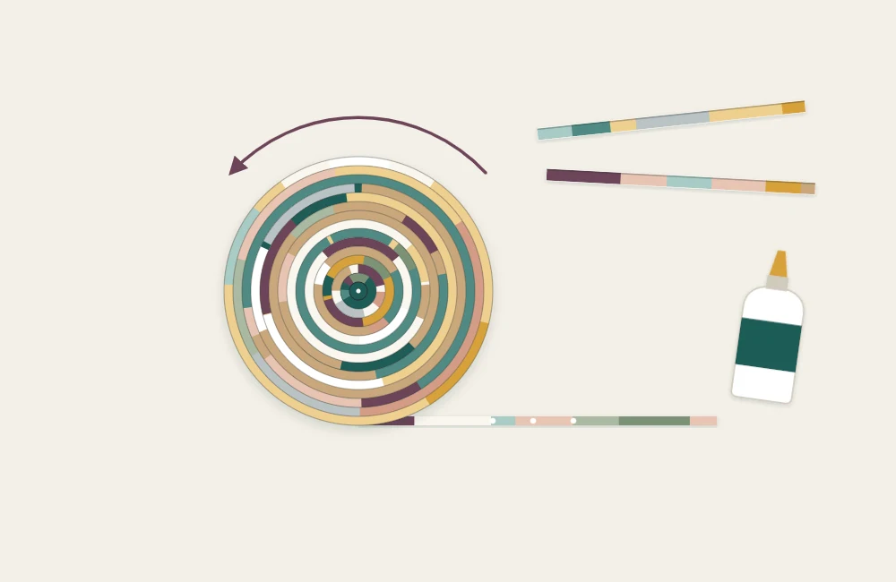 Folded magazine strips wound into a tight, flat disc with the end of a strip still loose
