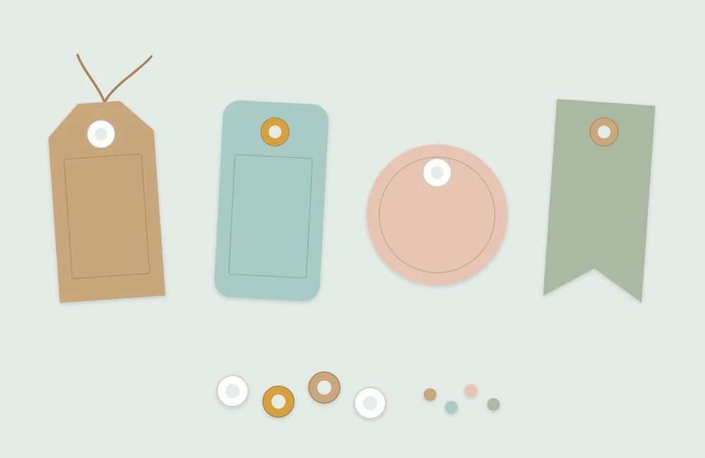Several paper tag shapes with clipped corners, each with a punched hole surrounded by a contrasting reinforcement ring