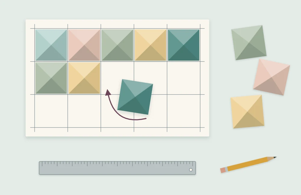 Paper pyramid modules being set into the ruled squares of a backing board